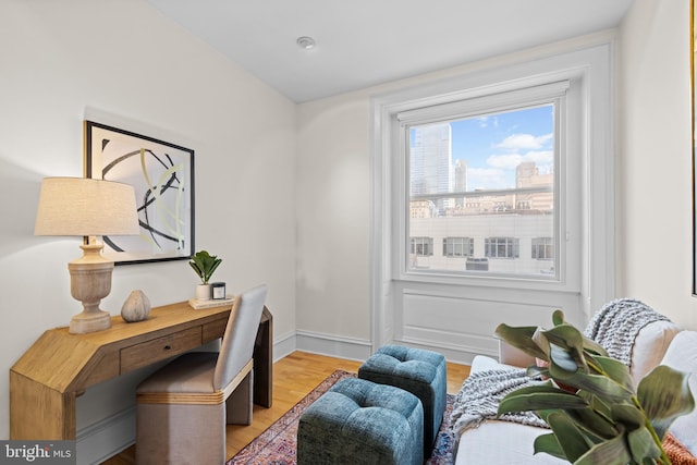 office featuring light wood-style floors and baseboards