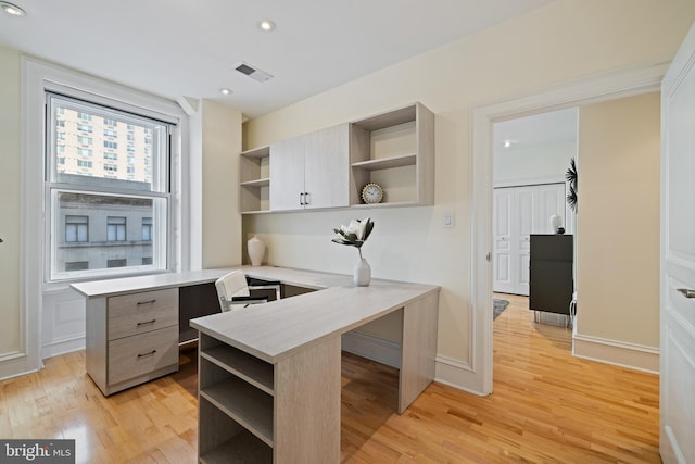 office area featuring light wood finished floors, visible vents, and recessed lighting