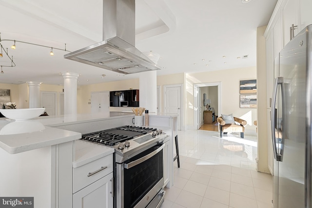 kitchen featuring light tile patterned floors, white cabinets, open floor plan, island exhaust hood, and stainless steel appliances