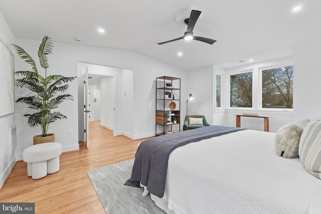 bedroom featuring lofted ceiling, recessed lighting, visible vents, baseboards, and light wood-type flooring