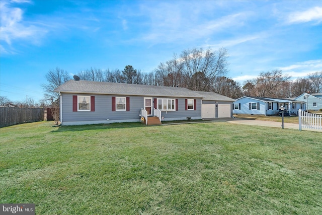 single story home with driveway, a front yard, and fence