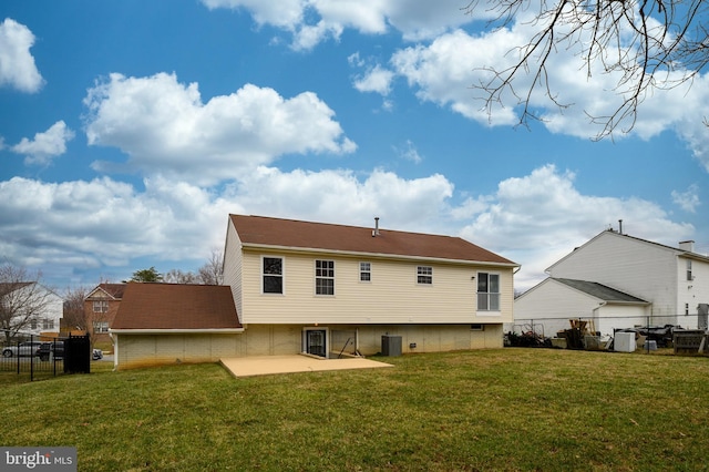 back of property featuring a patio area, fence, and a yard