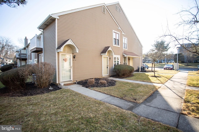 view of home's exterior featuring a lawn