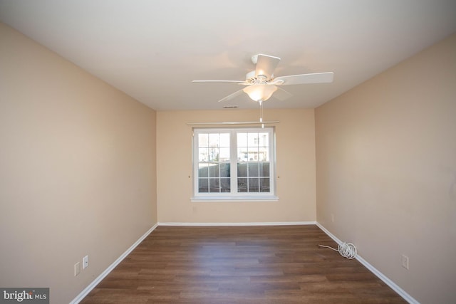 empty room featuring visible vents, ceiling fan, baseboards, and wood finished floors