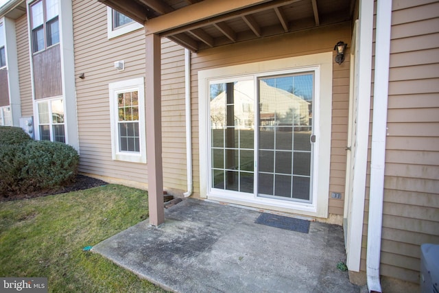 entrance to property with a patio area