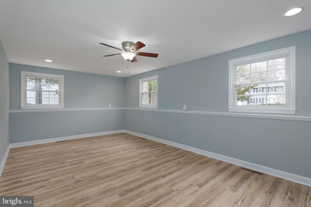 empty room with recessed lighting, visible vents, light wood-style floors, ceiling fan, and baseboards