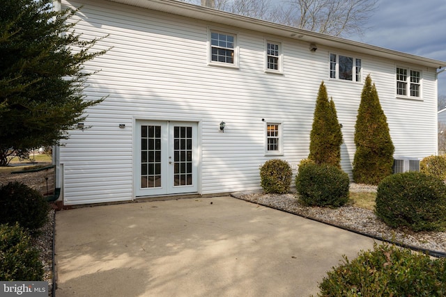 back of property featuring french doors and a patio area