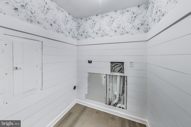 laundry room with wood finished floors