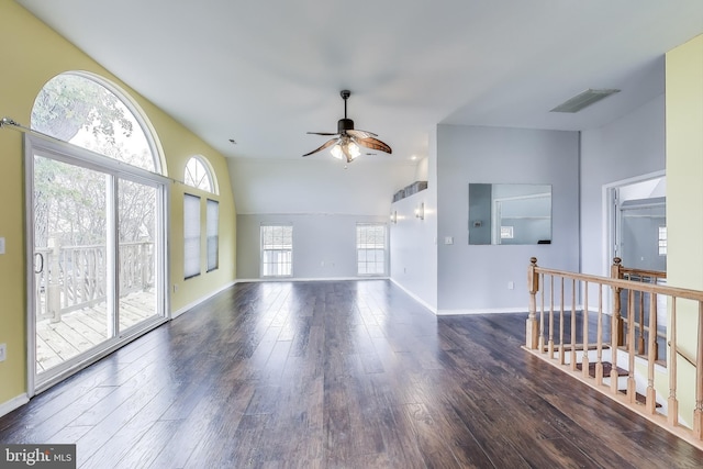 unfurnished room with a ceiling fan, visible vents, baseboards, and wood finished floors