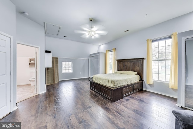 bedroom featuring ceiling fan, dark wood-type flooring, ensuite bathroom, and baseboards