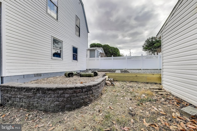 view of yard featuring fence