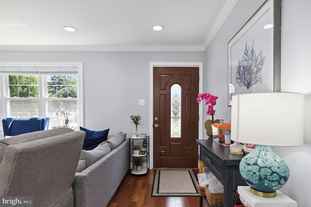 entryway with dark wood-style floors, crown molding, and recessed lighting