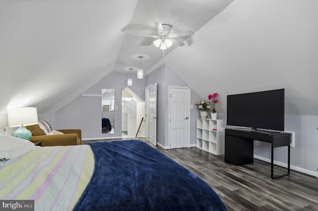 bedroom featuring lofted ceiling, ceiling fan, wood finished floors, and baseboards