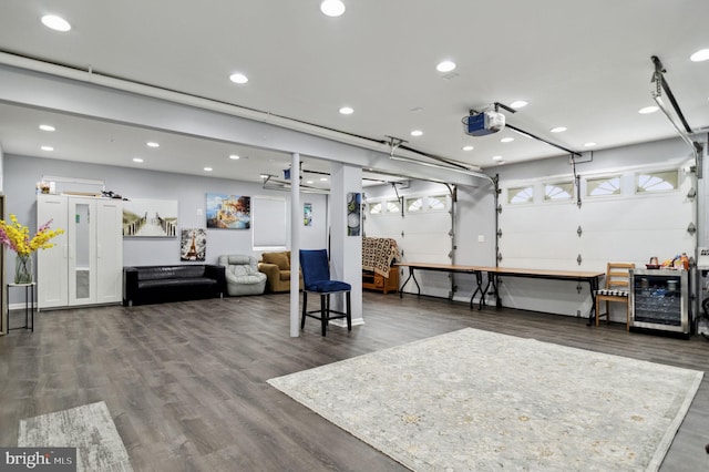 garage with a garage door opener and recessed lighting