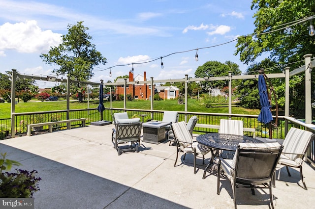 view of patio featuring a fire pit and outdoor dining space