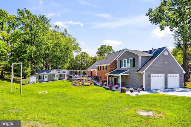 view of front of home with a garage, driveway, and a front yard