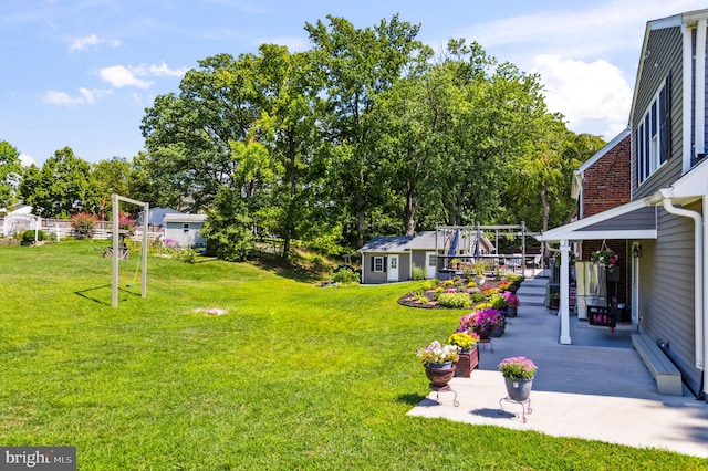 view of yard with a patio area and an outdoor structure