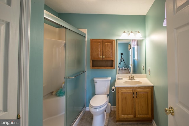 bathroom with toilet, a stall shower, tile patterned floors, and vanity