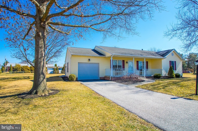 ranch-style home with aphalt driveway, a porch, an attached garage, and a front yard