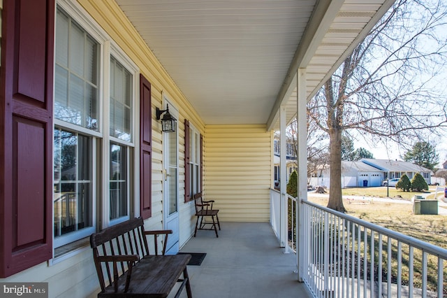 balcony featuring a porch and a residential view