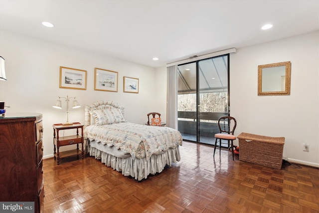 bedroom with access to exterior, recessed lighting, and baseboards