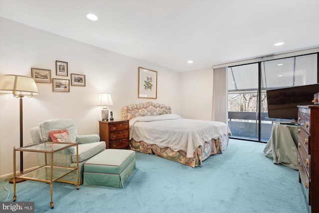 bedroom featuring access to exterior, carpet, a wall of windows, and recessed lighting