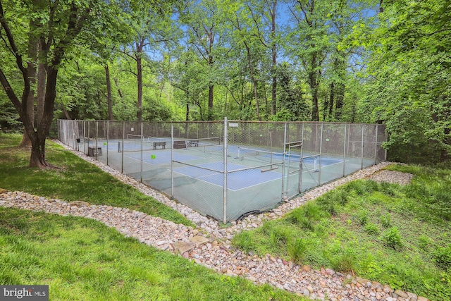 view of sport court with fence