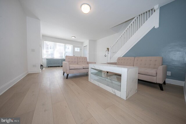 426 Hampden Rd, Upper Darby, PA 19082 - living area with light wood-style flooring, baseboards, and stairway