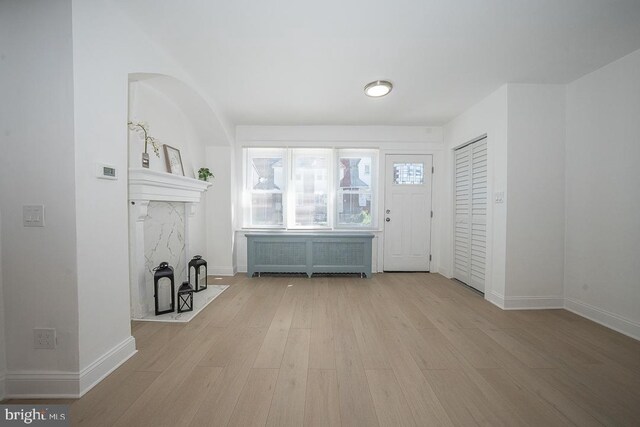 426 Hampden Rd, Upper Darby, PA 19082 - unfurnished living room featuring radiator heating unit, wood finished floors, and baseboards