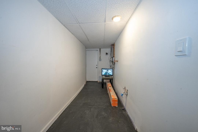 426 Hampden Rd, Upper Darby, PA 19082 - hall featuring baseboards, concrete flooring, and a paneled ceiling