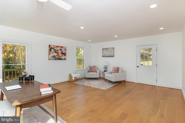 sitting room featuring light wood finished floors, ceiling fan, baseboards, and recessed lighting