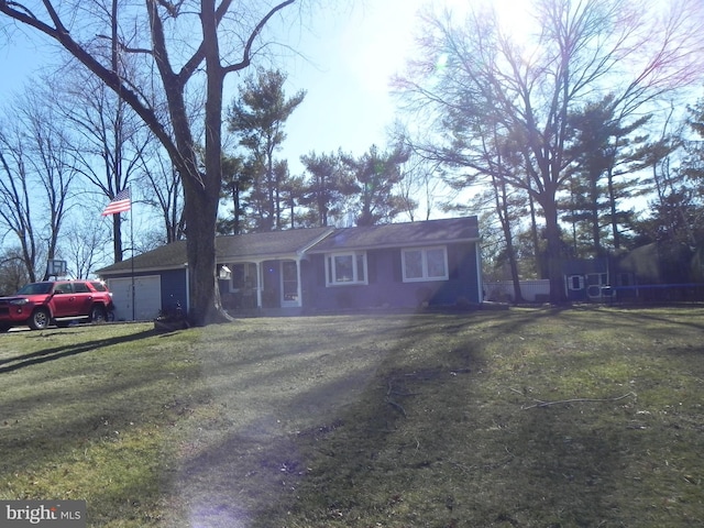 single story home with a garage and a front yard