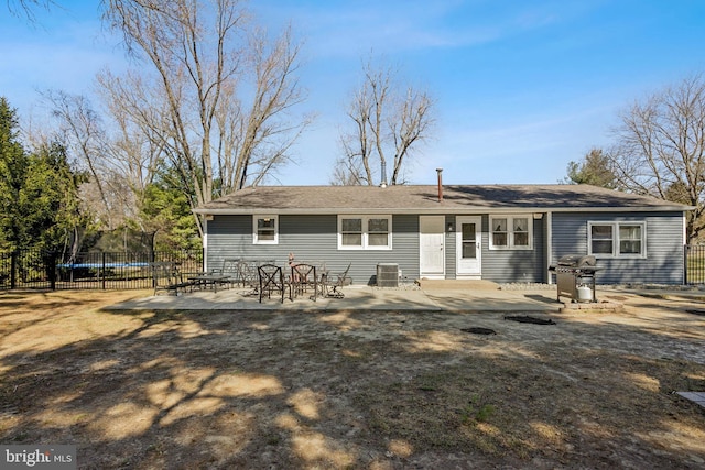 back of house featuring a patio area and fence