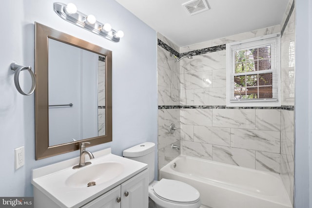 bathroom featuring toilet, bathtub / shower combination, vanity, and visible vents