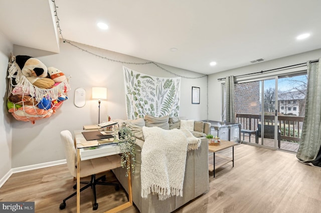 interior space with recessed lighting, visible vents, baseboards, and wood finished floors