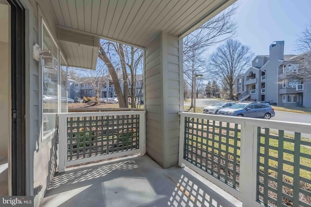 balcony featuring a porch and a residential view