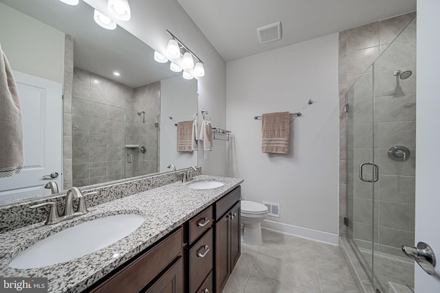 full bathroom featuring a shower stall, visible vents, and a sink