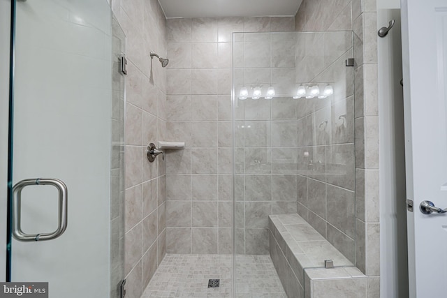 bathroom featuring a shower stall