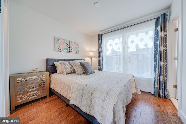 bedroom with wood finished floors