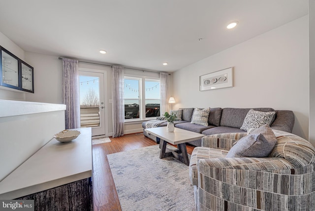 living room featuring recessed lighting and wood finished floors