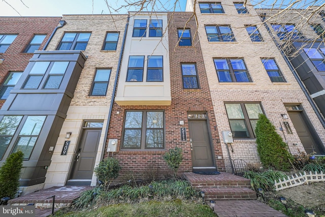 view of property featuring brick siding