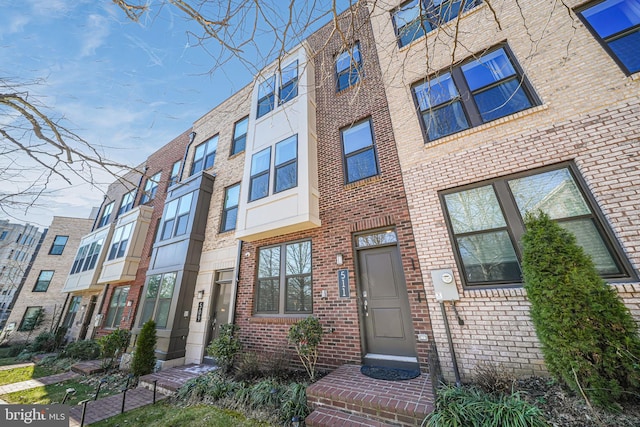 view of front of property featuring brick siding