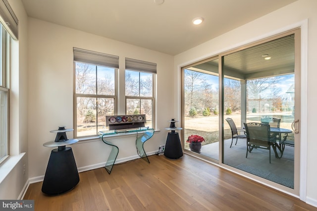 office featuring baseboards and wood finished floors