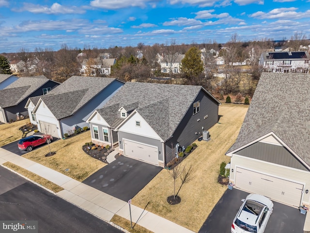 birds eye view of property with a residential view