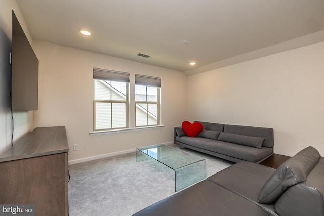 carpeted living room featuring recessed lighting, visible vents, and baseboards