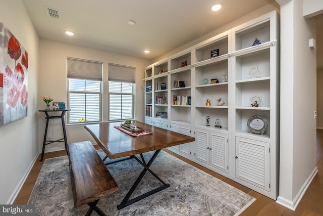 office area with dark wood-style flooring, visible vents, and recessed lighting