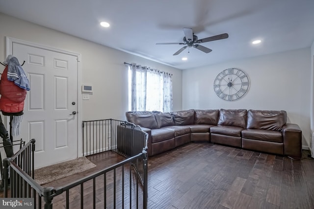 living area featuring ceiling fan, dark wood-type flooring, and recessed lighting