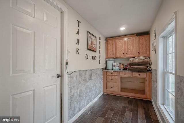 interior space with dark wood-type flooring, wainscoting, and recessed lighting