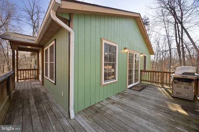 wooden terrace featuring area for grilling