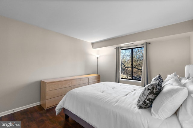 bedroom featuring baseboards